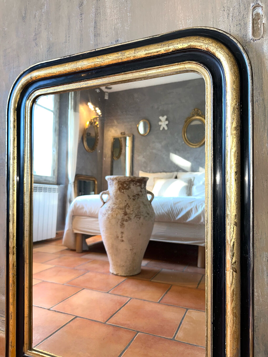 Louis-Philippe black and gold antique mirror from the 19th century