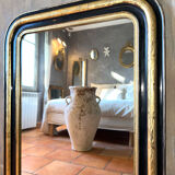 Louis-Philippe black and gold antique mirror from the 19th century