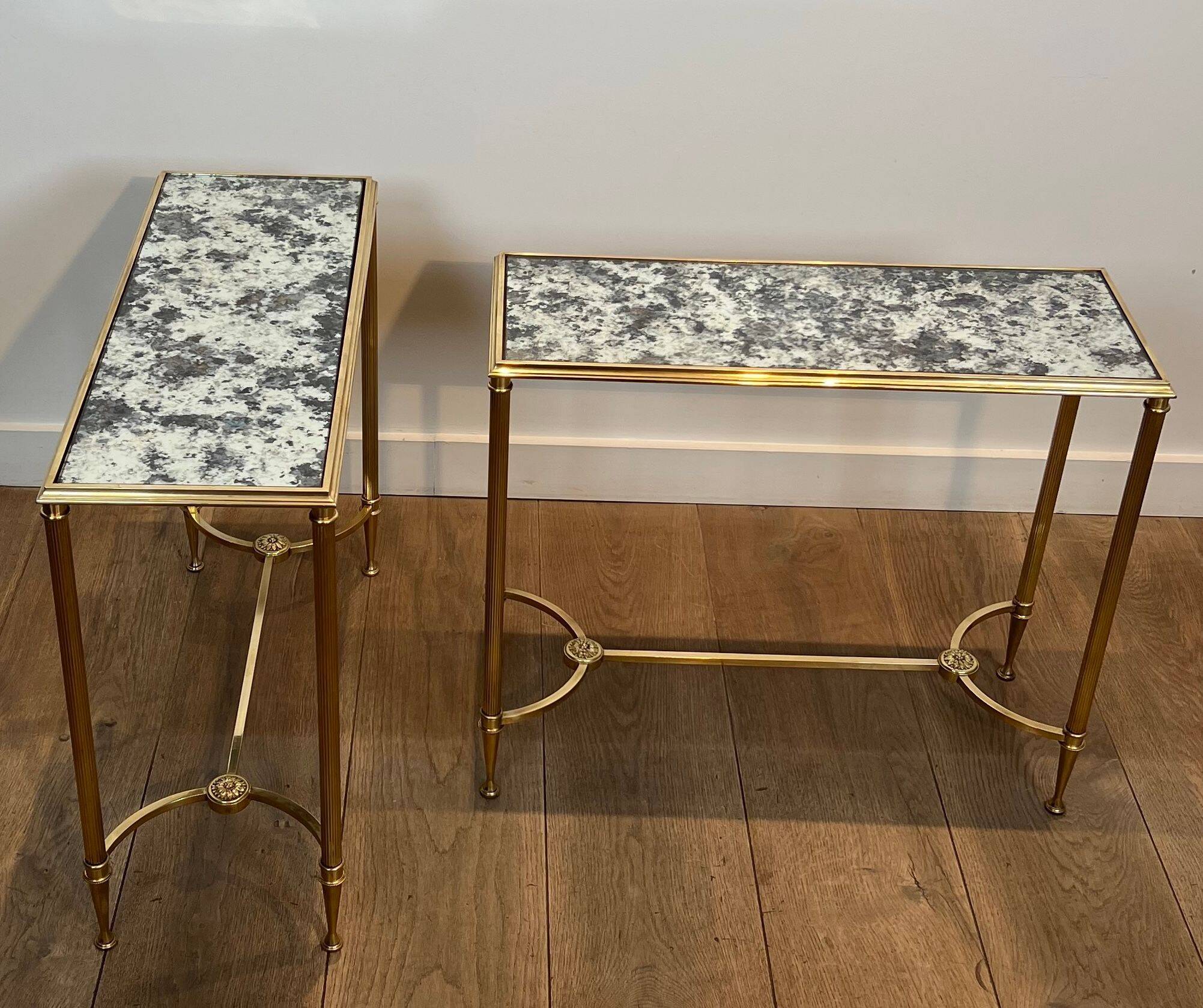 Pair of brass and antique mirror side tables from the Baguès house.