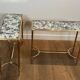 Pair of brass and antique mirror side tables from the Baguès house.