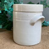 White pot in glazed earth