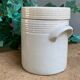 White pot in glazed earth