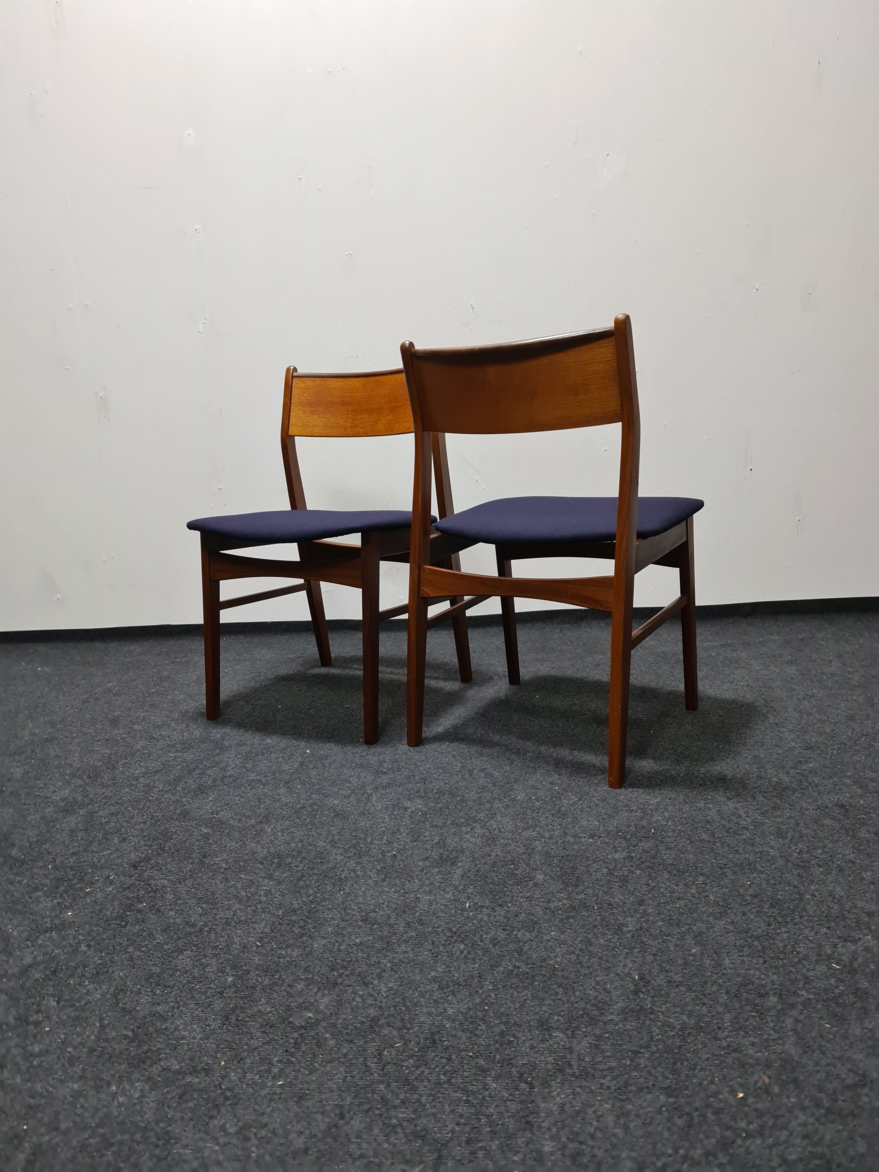A pair of vintage teak dinning chairs
