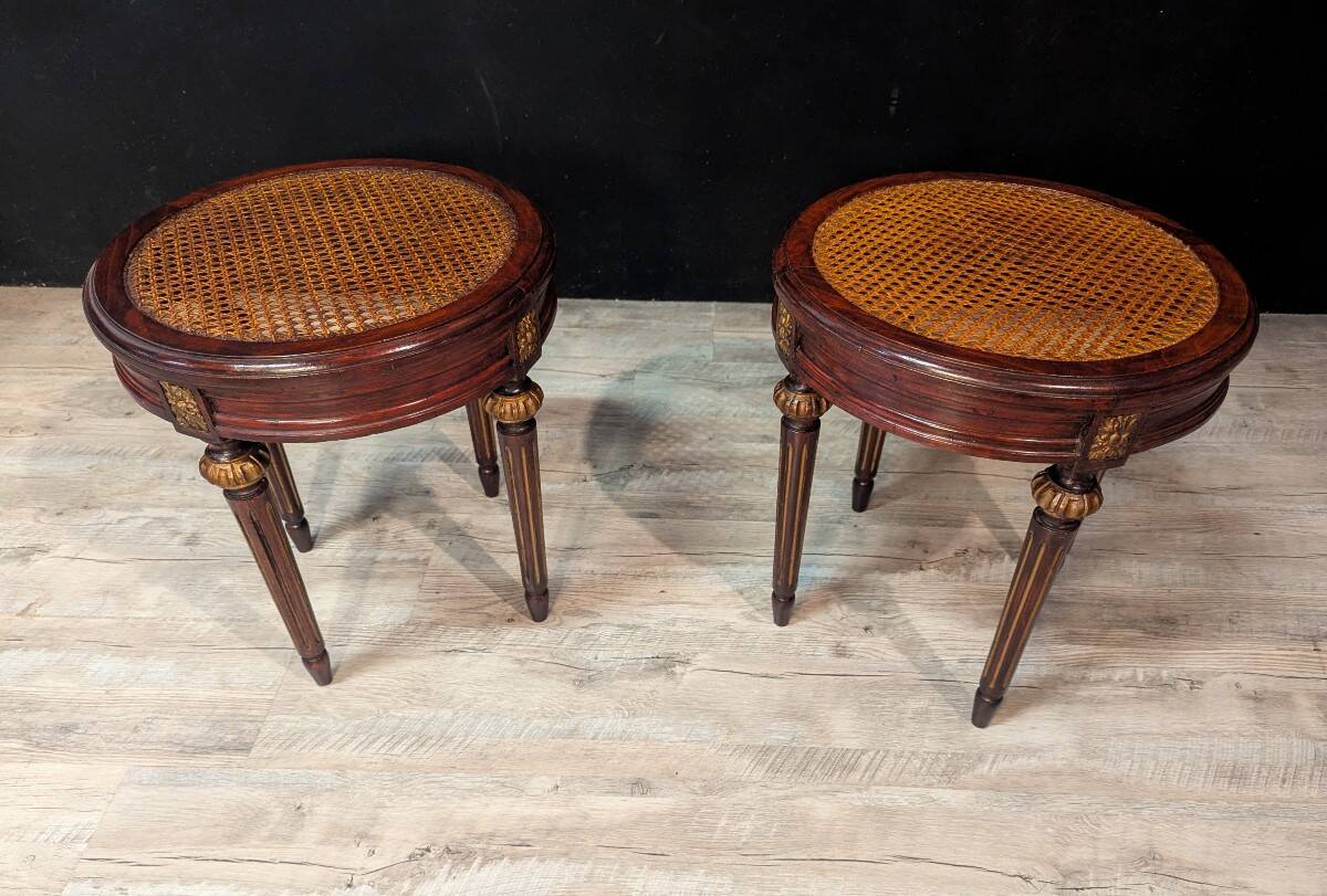 Pair of Louis XVI style stools with caned seats.