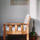 Brutalist armchair in wood and bouclé fabric