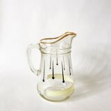 glass pitcher with black psyche patterns with gold edging from the 60s and 70s