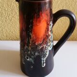 Service to orangeade of Vallauris ceramic lava aspect of black, red and white color.