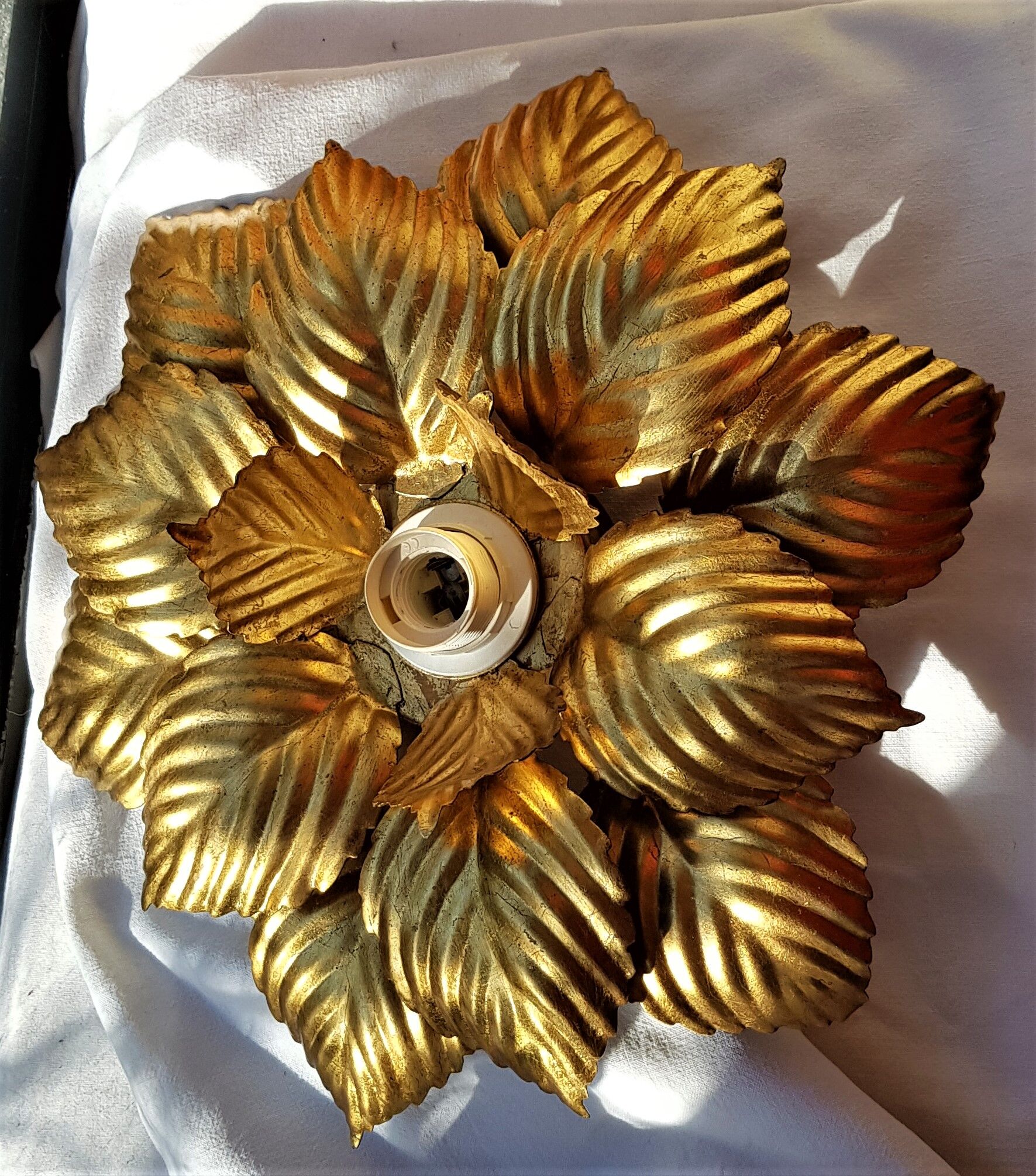 Golden metal flower sconce