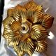 Golden metal flower sconce