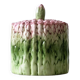 Old mustard pot and its slid in slurry decoration bunch of asparagus.