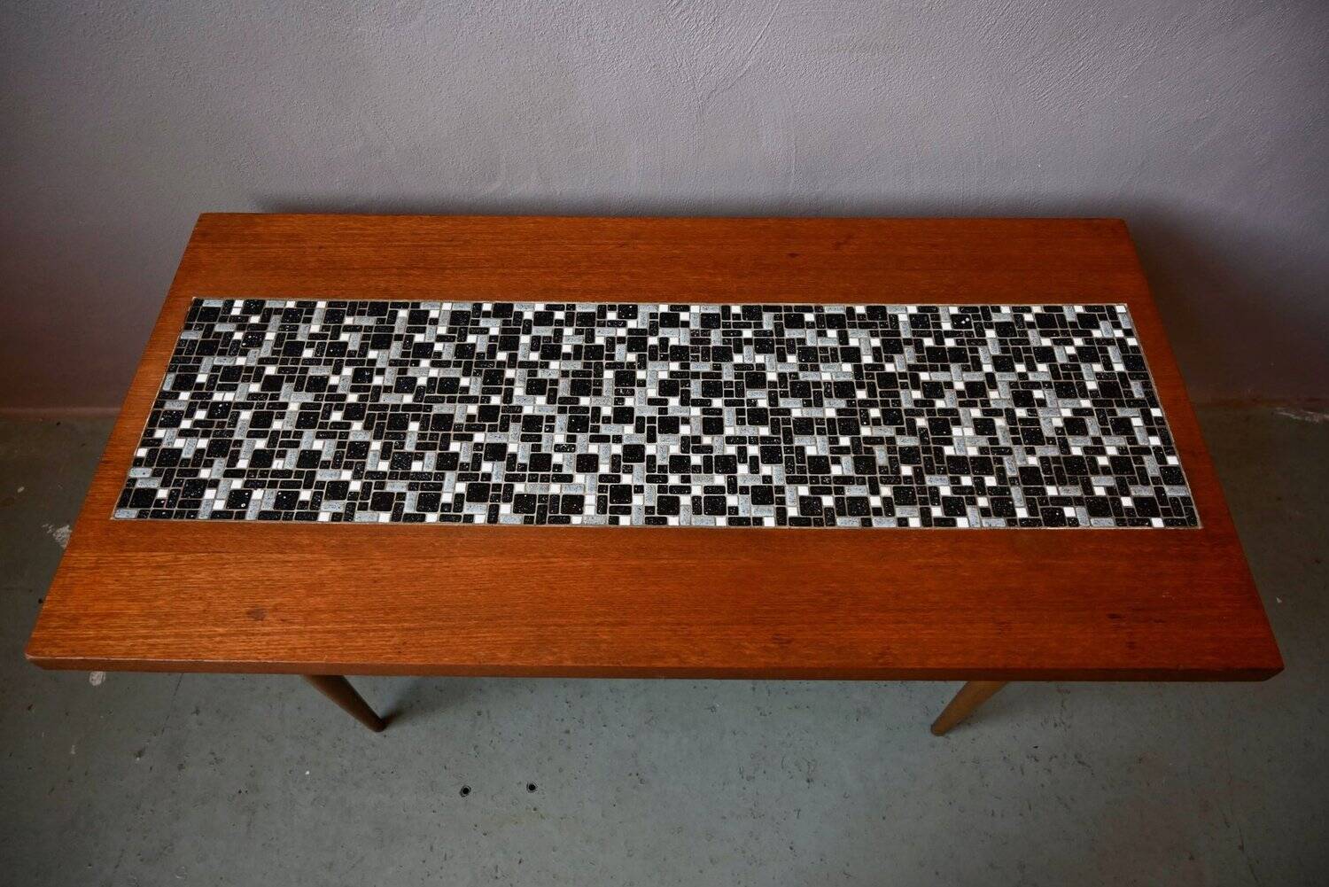 1970s coffee table with a tapered teak base and ceramic mosaic.