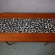 1970s coffee table with a tapered teak base and ceramic mosaic.