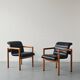 Pair of vintage Flototto armchairs in leather and wood, 1980s.