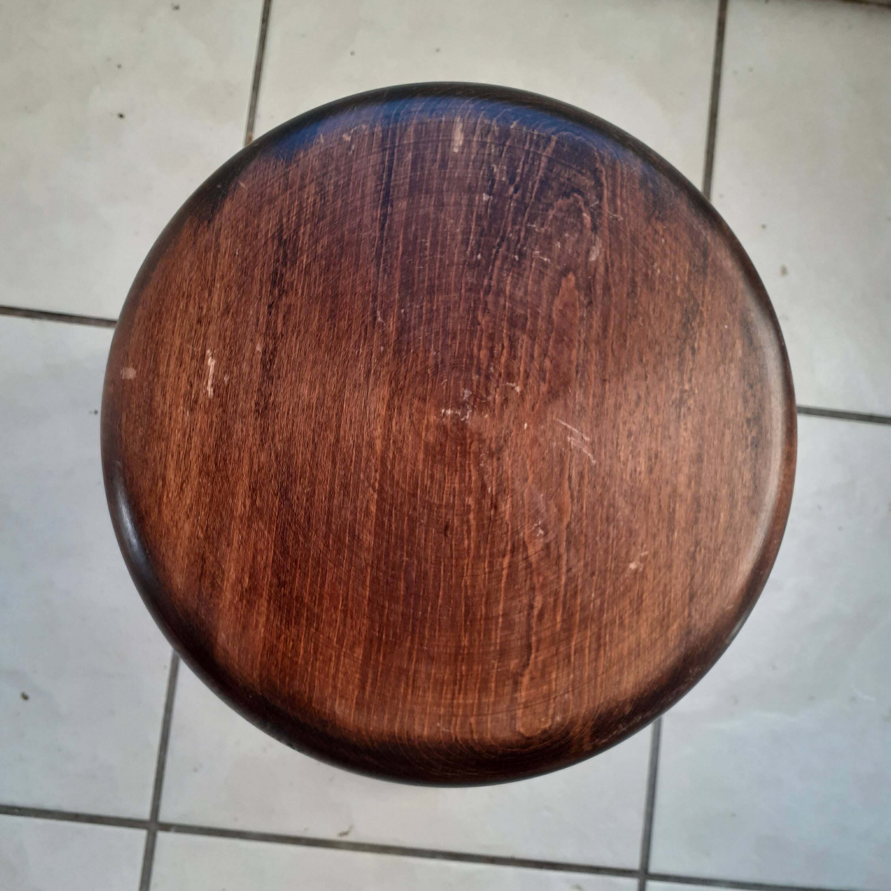 Tripod stool in dark wood. legs turned