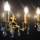 Pair of gilt bronze wall sconces with crystal pendants.