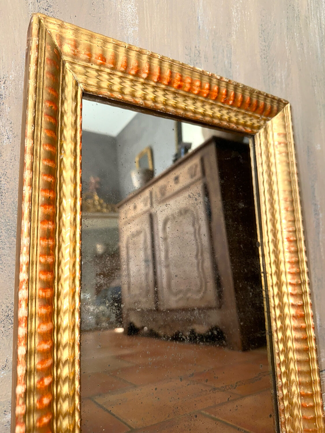 Antique gilded mirror from the Directoire period, 19th century.