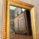 Antique gilded mirror from the Directoire period, 19th century.