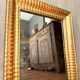Antique gilded mirror from the Directoire period, 19th century.