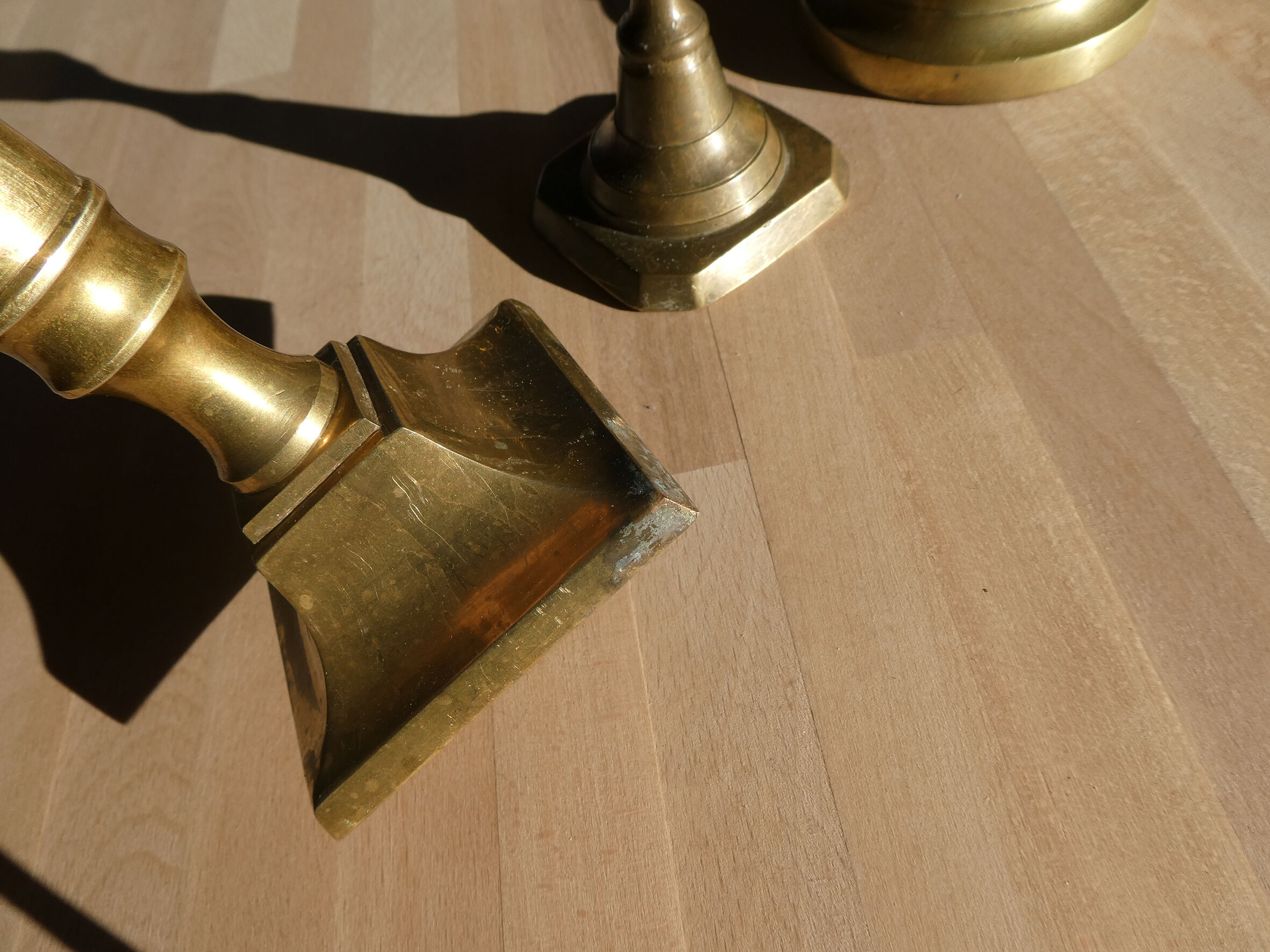 Set of 4 old candle holders in golden brass