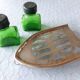 Salt/pepper green glass jars on metal base