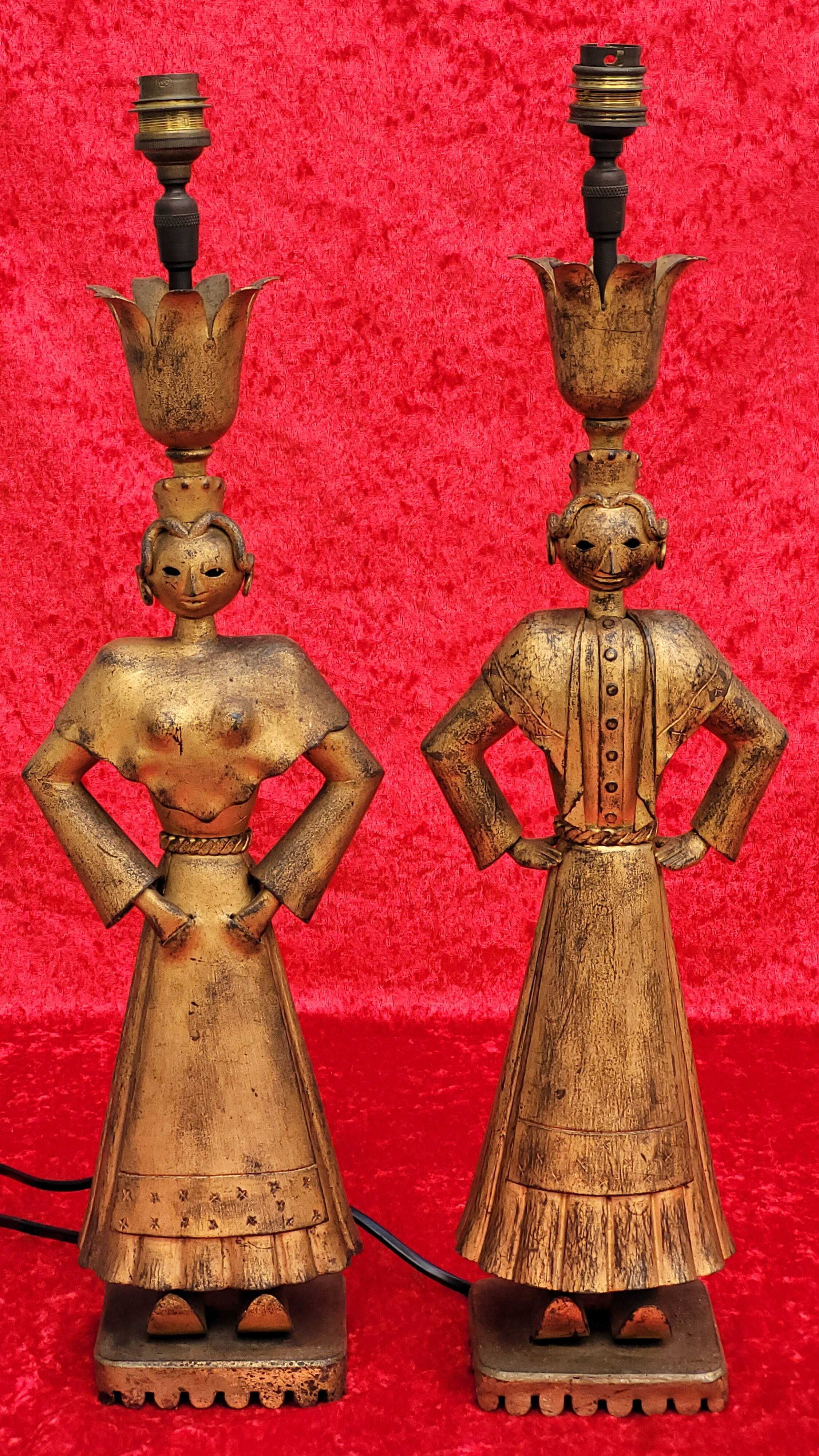 Pair of gilded beaten iron sculpture lamps attributed to Gilbert Poillerat