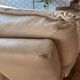 Fauteuil / Causeuse vintage cuir beige avec structure métal