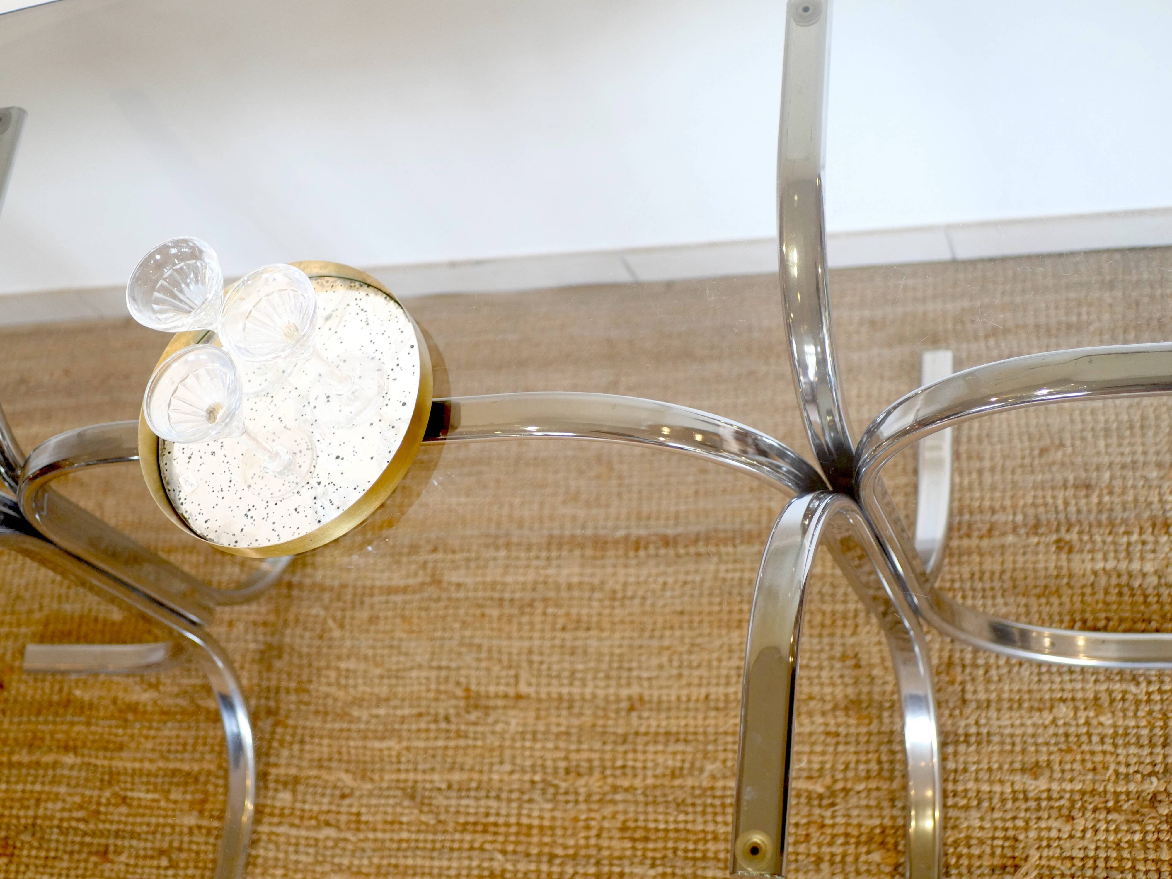 Dining table with smoked glass top and chrome base.