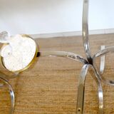 Dining table with smoked glass top and chrome base.
