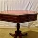 Vintage octagonal gueridon, 4 drawers, leather top, lion's paw feet.