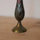 Vintage brass soliflore vase with black, red, and green floral decoration – H 18 cm
