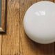 Small wall-mounted ceiling light half-moon 14 cm opal glass