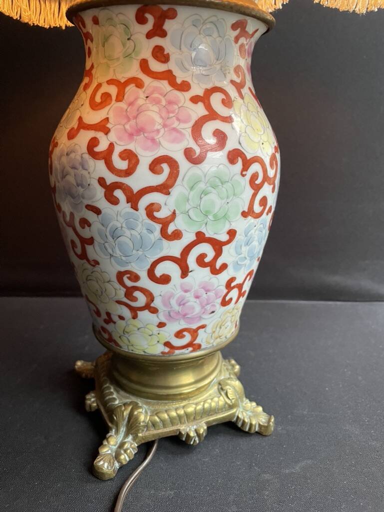 Old Asian vase mounted as a lamp with pagoda lampshade