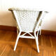 Vintage white rattan armchair
