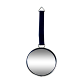 Vintage witch's eye curved mirror hangs velvet ribbon