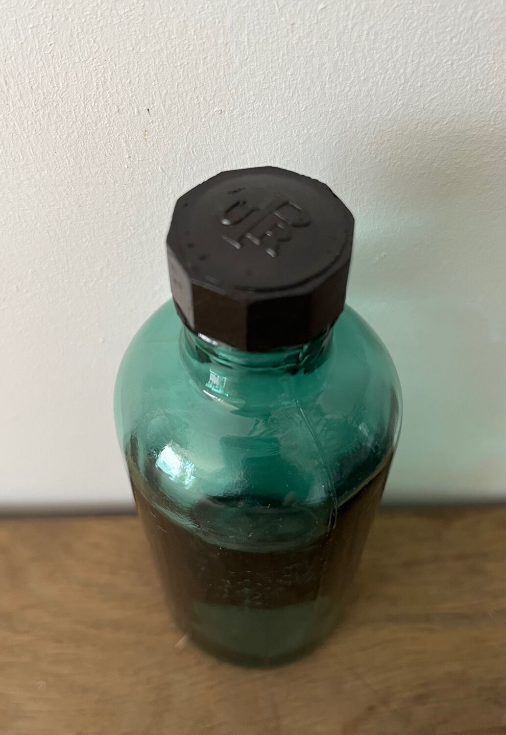 Small vintage dark turquoise blue bottle