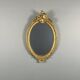 Oval gilded wooden mirror in Louis XV style, 19th century