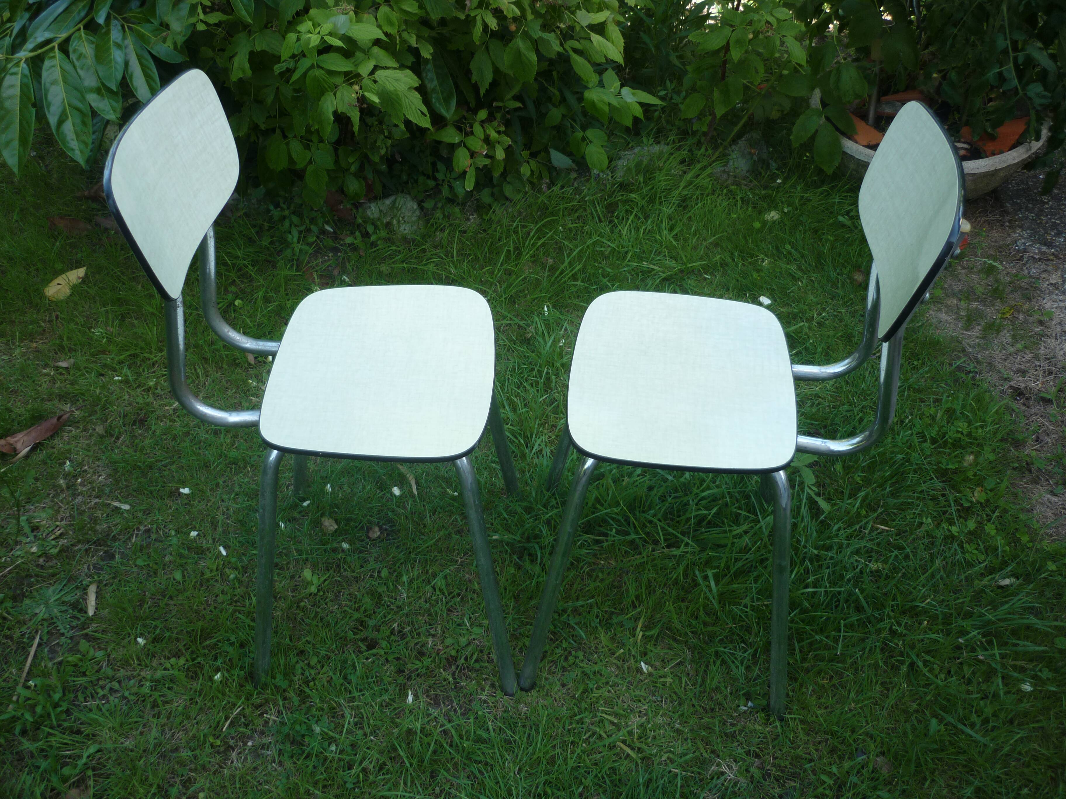 Pair of pale yellow formica chairs