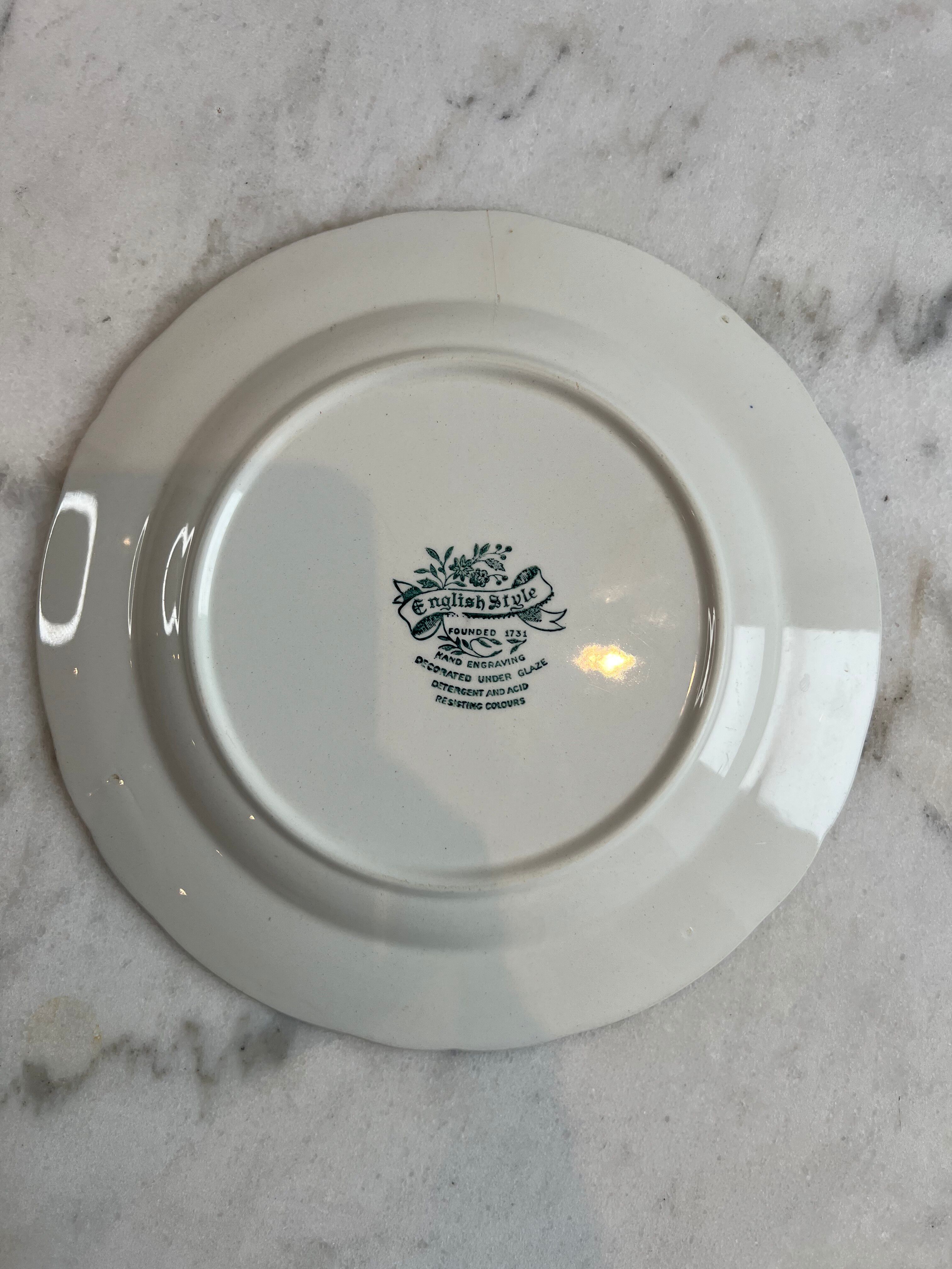 Set of four flat plates from English earthenware.