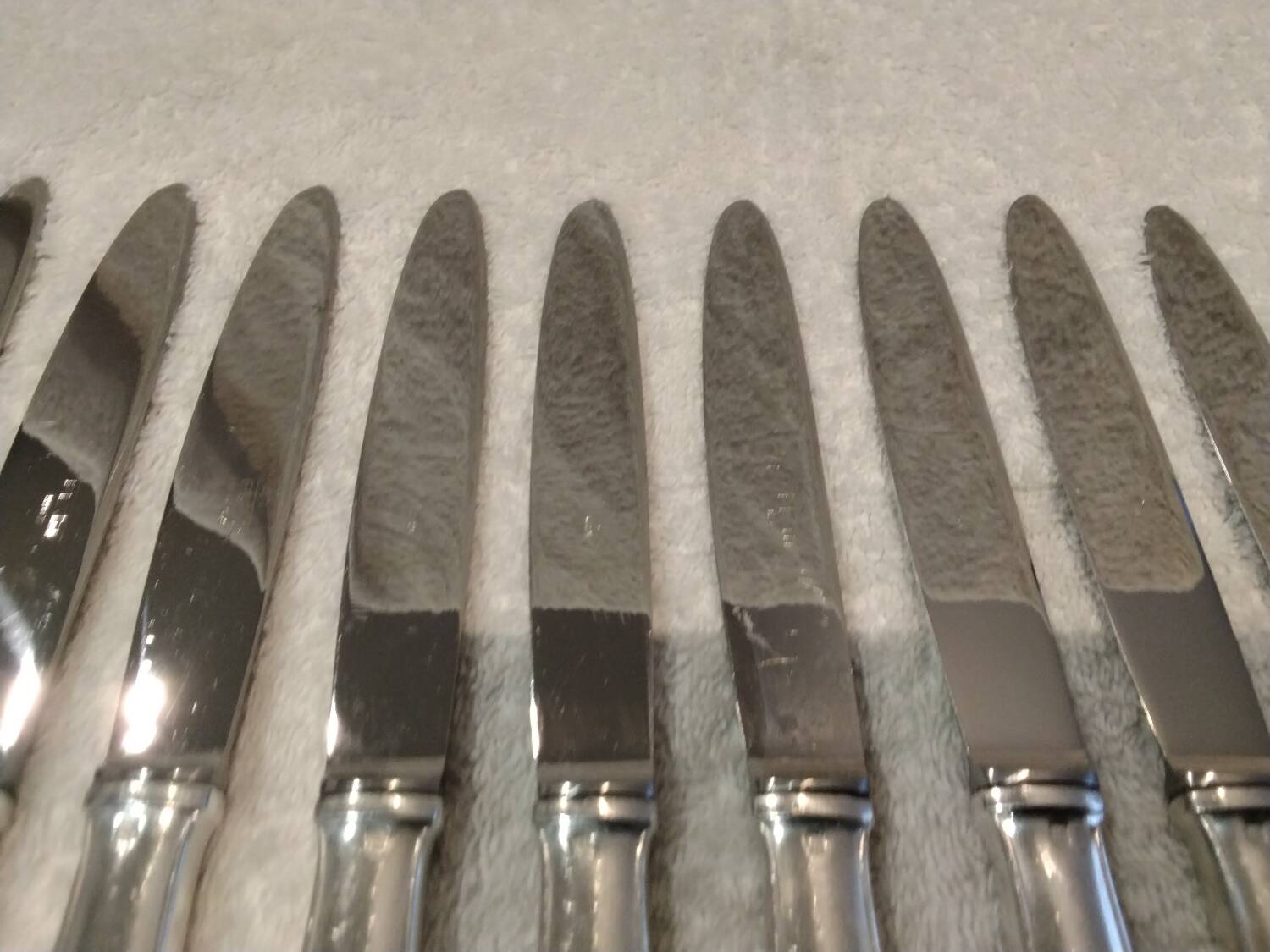 12 silver-plated dessert knives by Platil, rocaille style