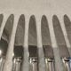 12 silver-plated dessert knives by Platil, rocaille style