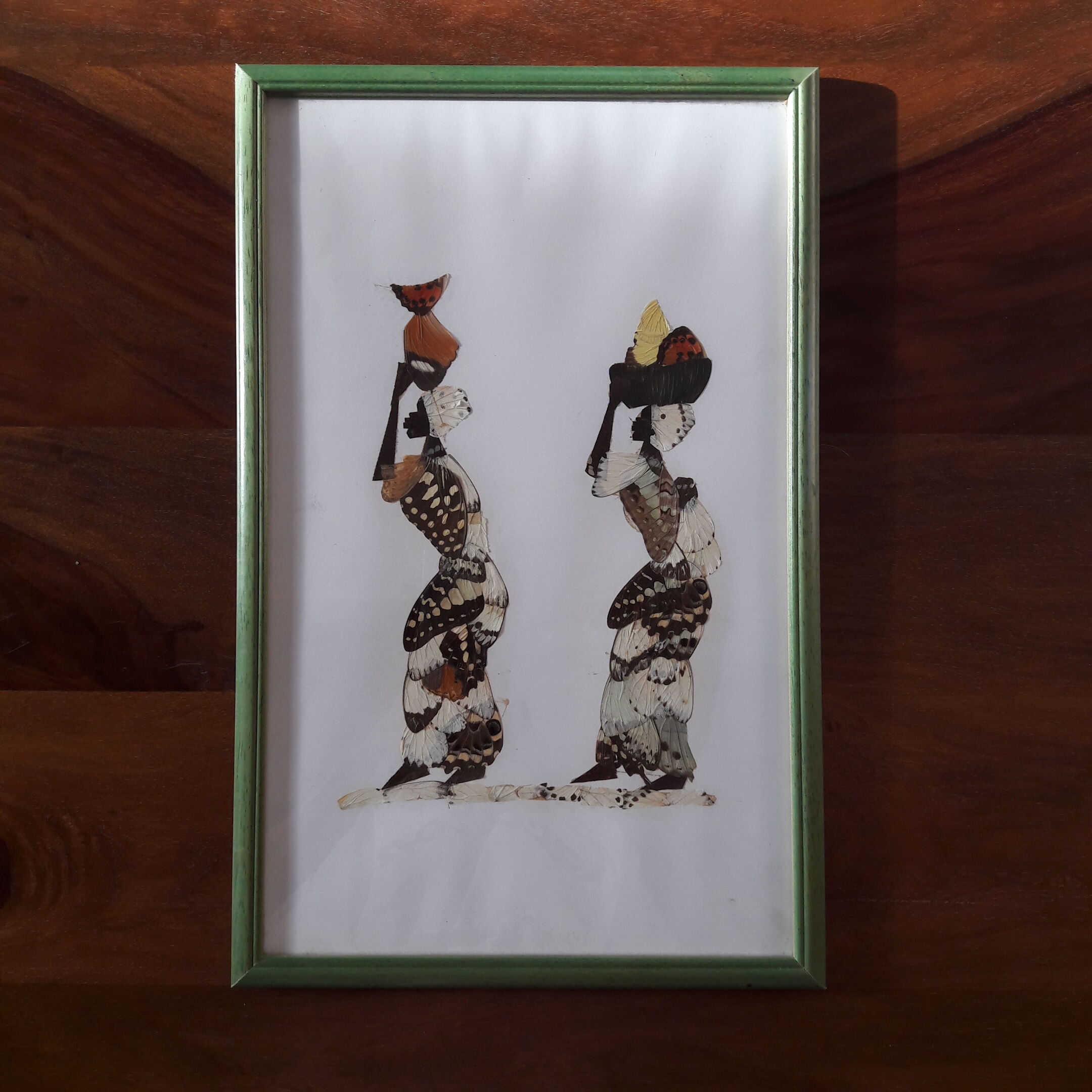 Butterfly wings painting with African women motif