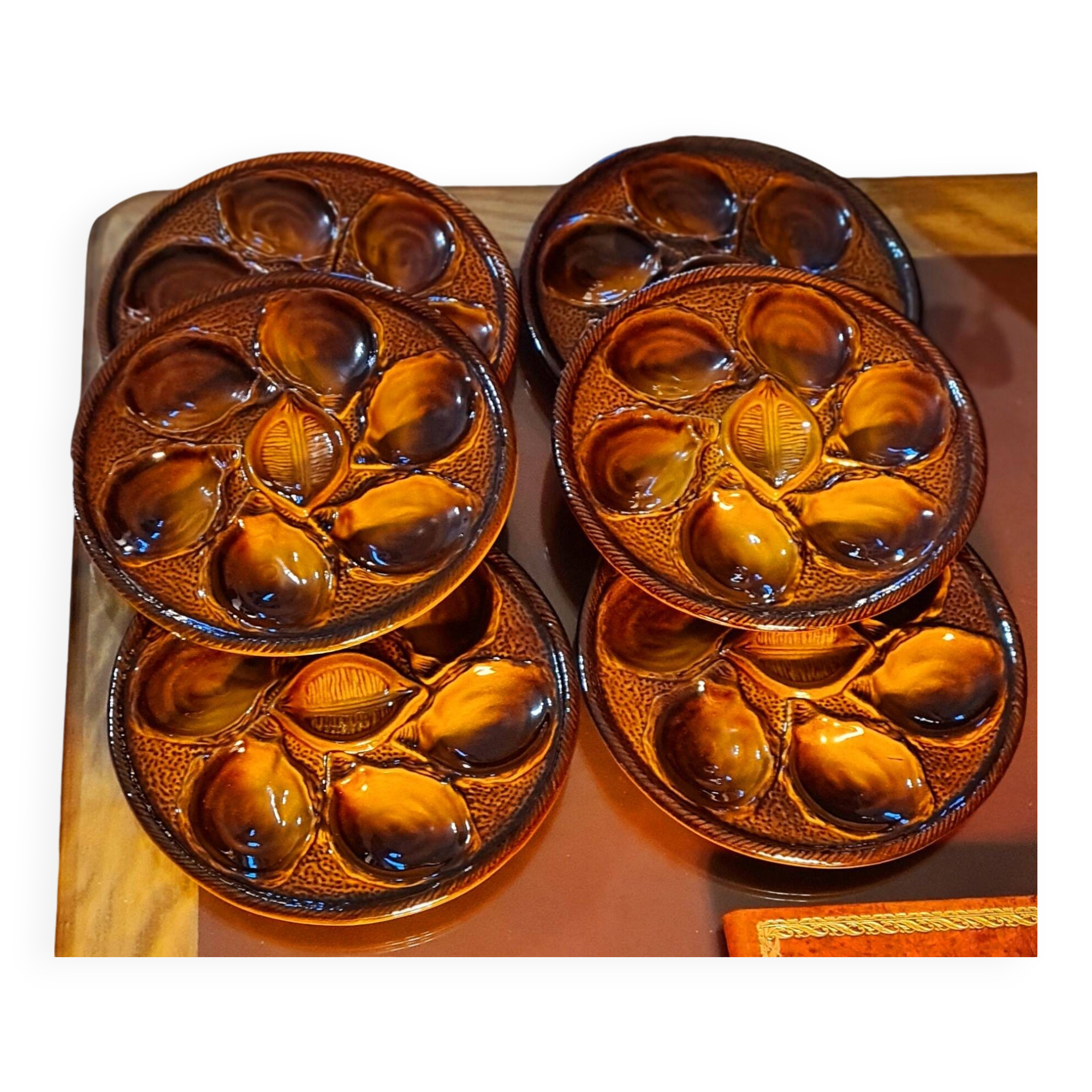 Six oyster plates signed Saint Clément