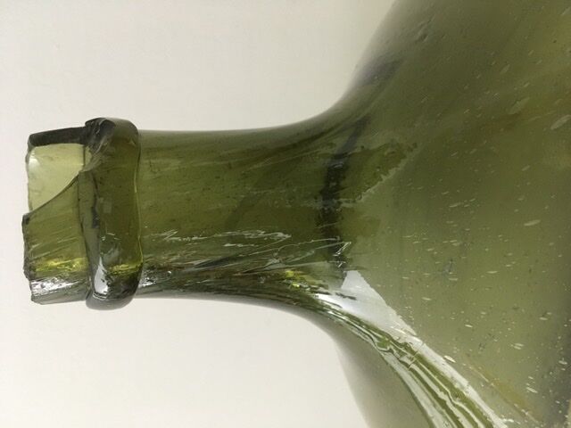 Old demijohn full of bubbles