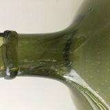 Old demijohn full of bubbles