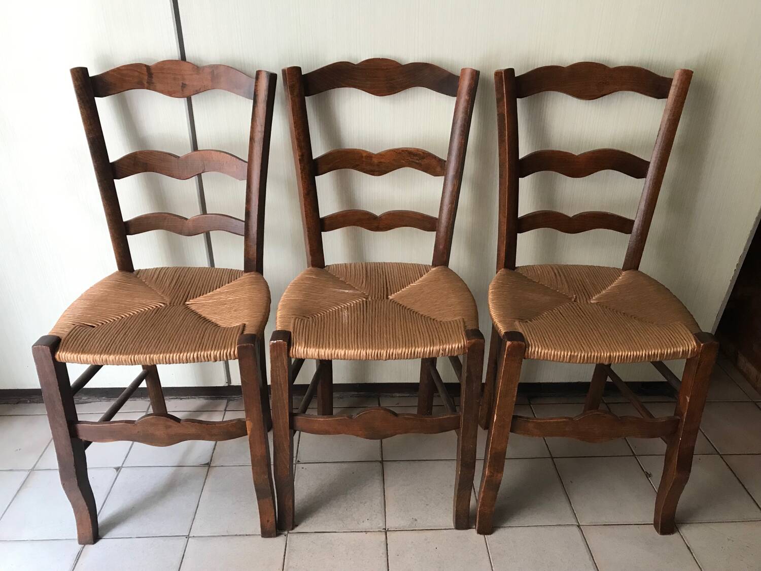 Wooden and straw chairs
