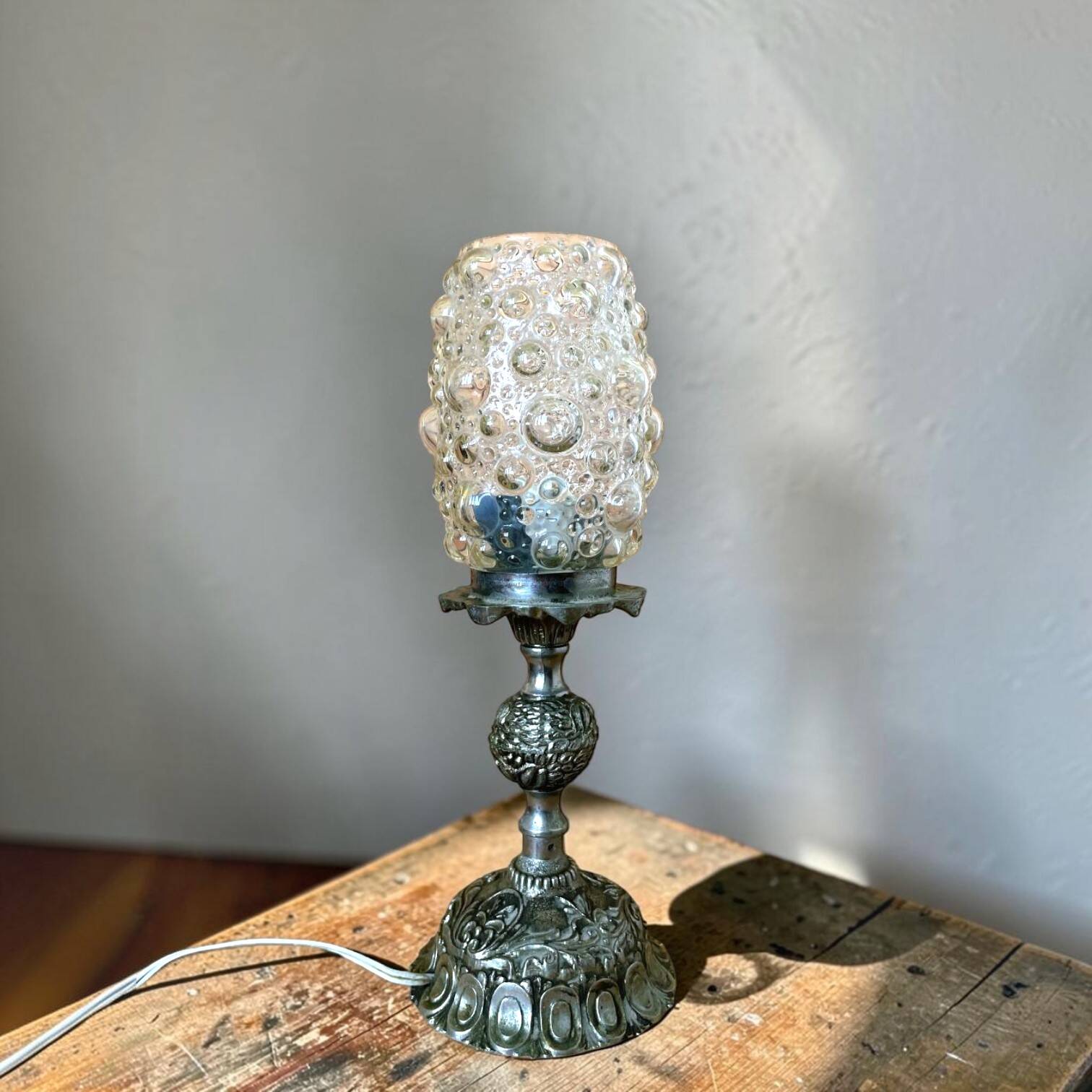 Baroque inspired ornate brass and bubble glass table