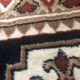 Wool carpet with oriental decoration on a brown background