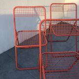 4 red 70s chairs
