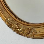 Oval mirror in carved wood