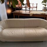 Rounded off-white leather sofa